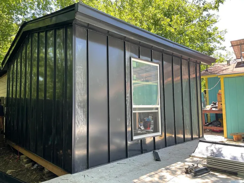 Black standing seam metal wall panels for Metal Roof Installation in Elwood