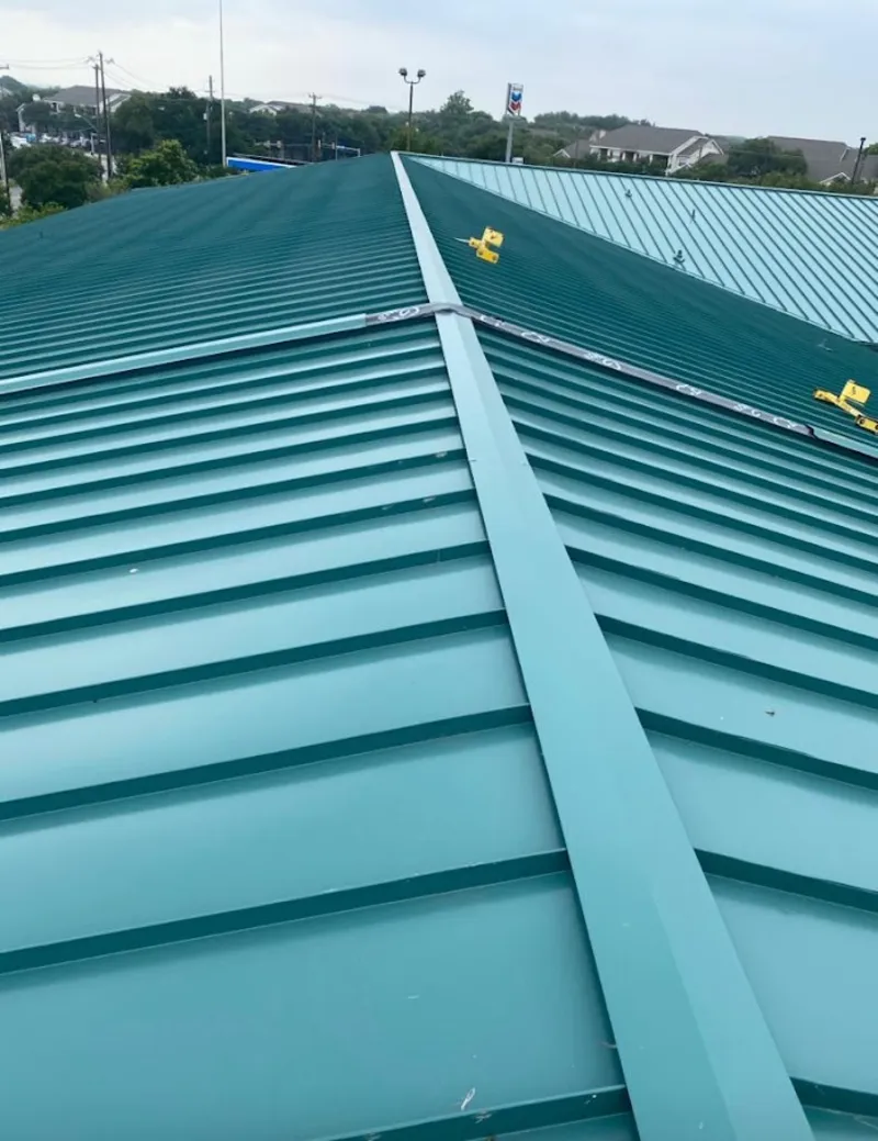Green commercial metal roof ridge and valley for Metal Roof Repair in Elwood